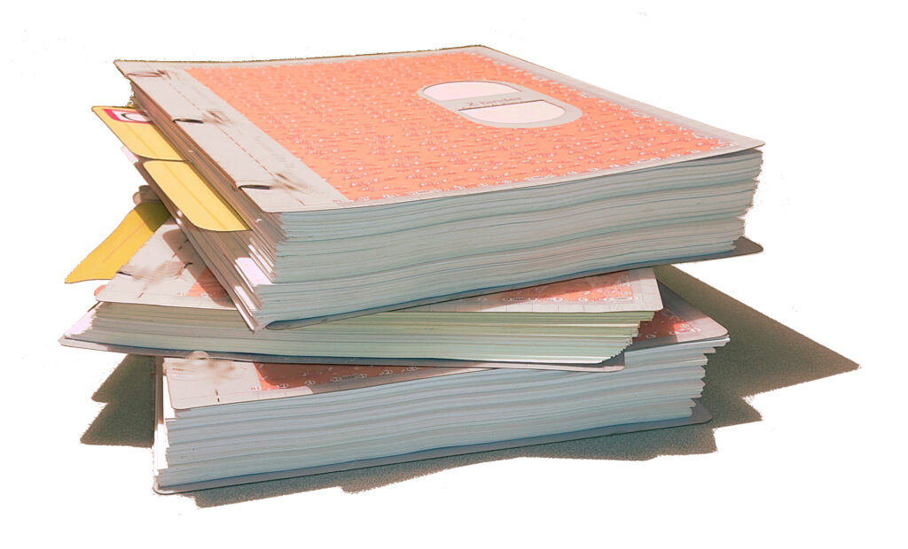 Stack of Spineless Binders with visible tags